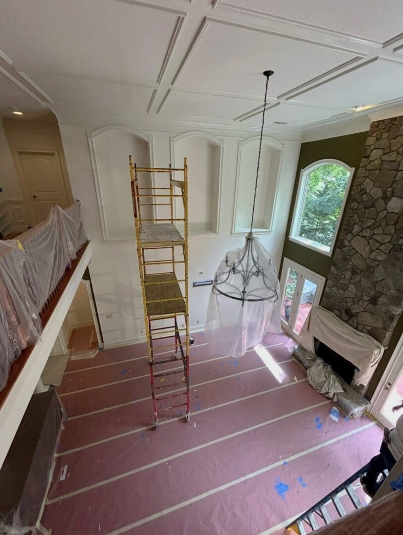 Two-story great room painting in progress