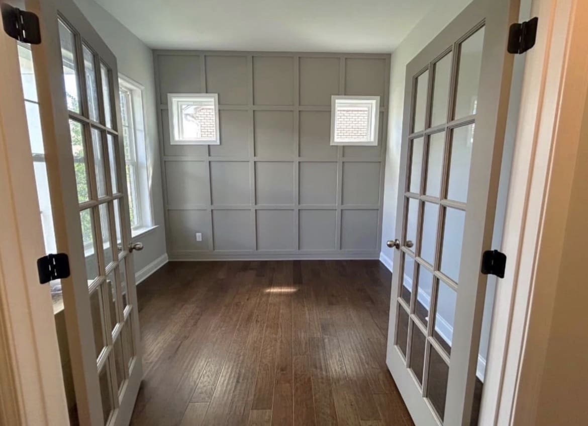 French doors and paneled accent wall after