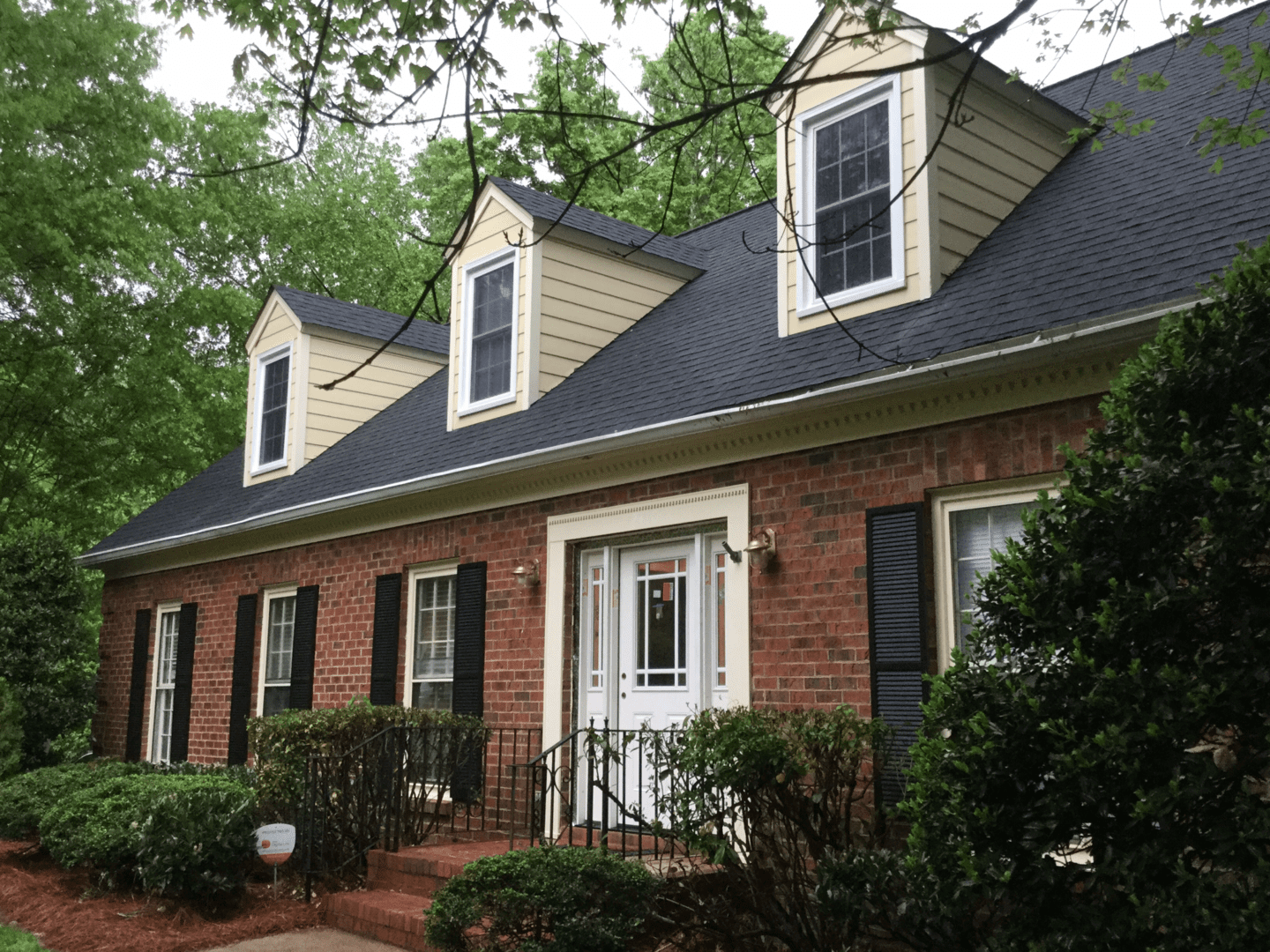 Brick home before painting