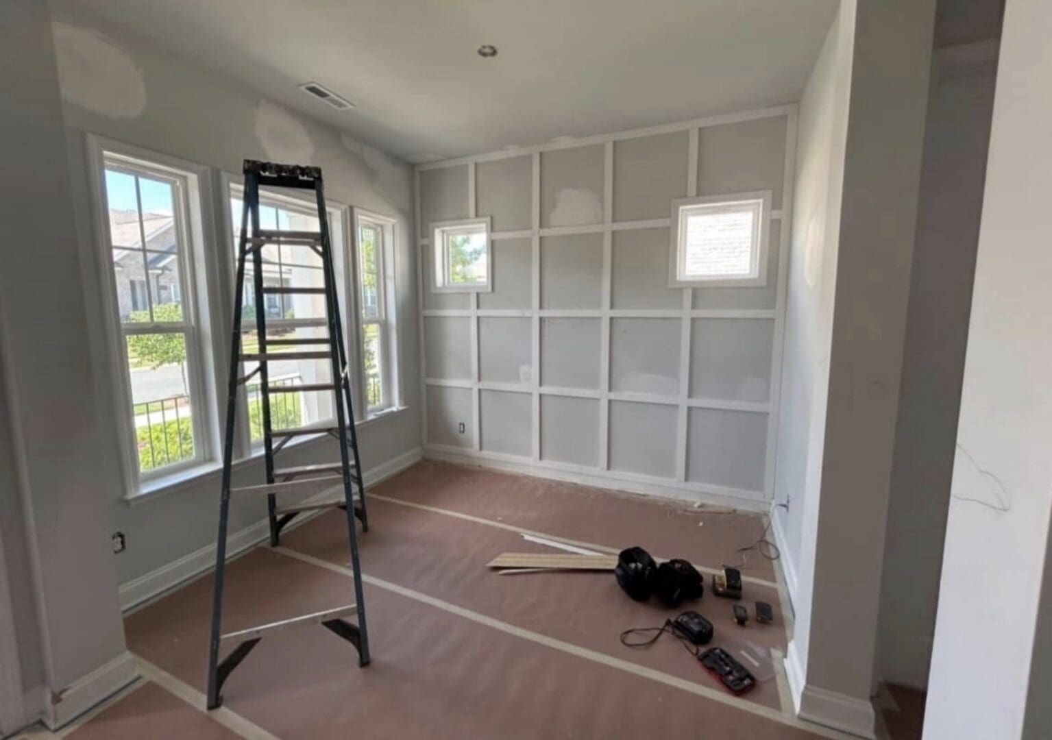 French doors and paneled accent wall before